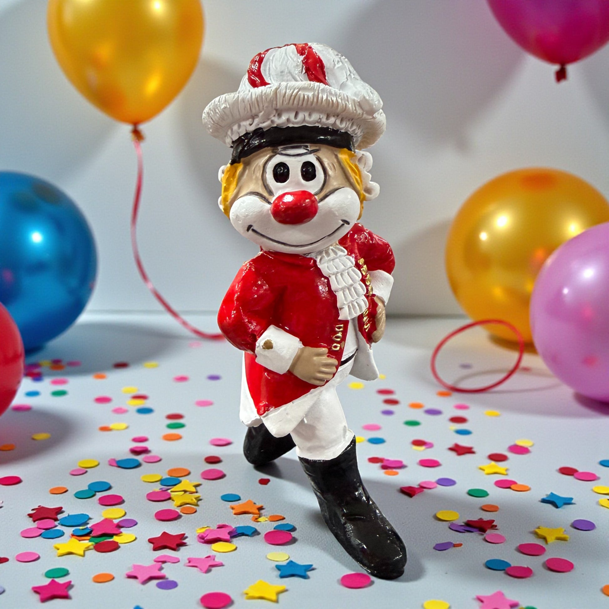 Tanzmajor und Tanzmariechen Clown-Figuren in Karnevalsdekoration mit Luftballons