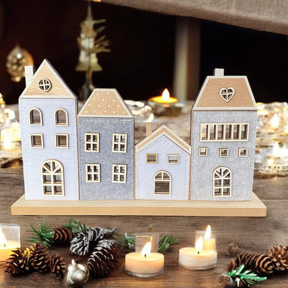 Häuserreihe aus Holz mit Filz im Ambiente platziert