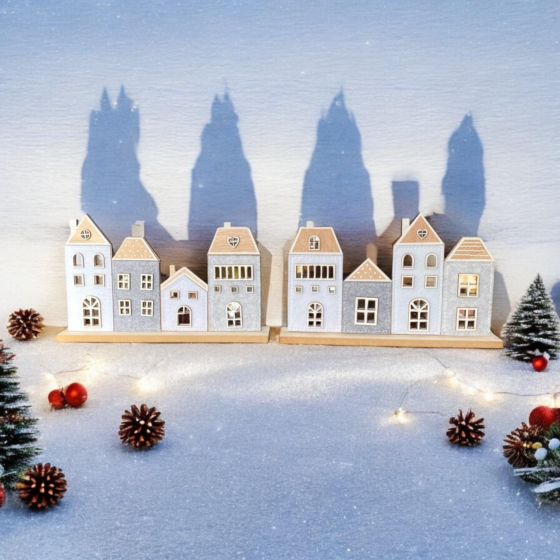 Häuserreihe aus Holz mit Filz in zwei verschiedenen Varianten im Ambiente platziert