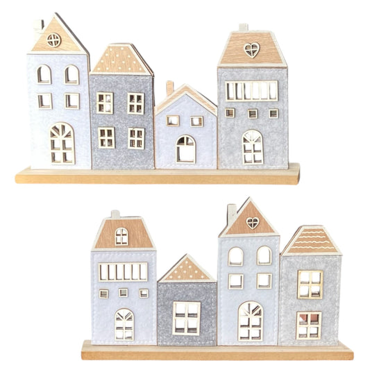 Häuserreihe aus Holz mit Filz in zwei verschiedenen Varianten vor weißem Hintergrund