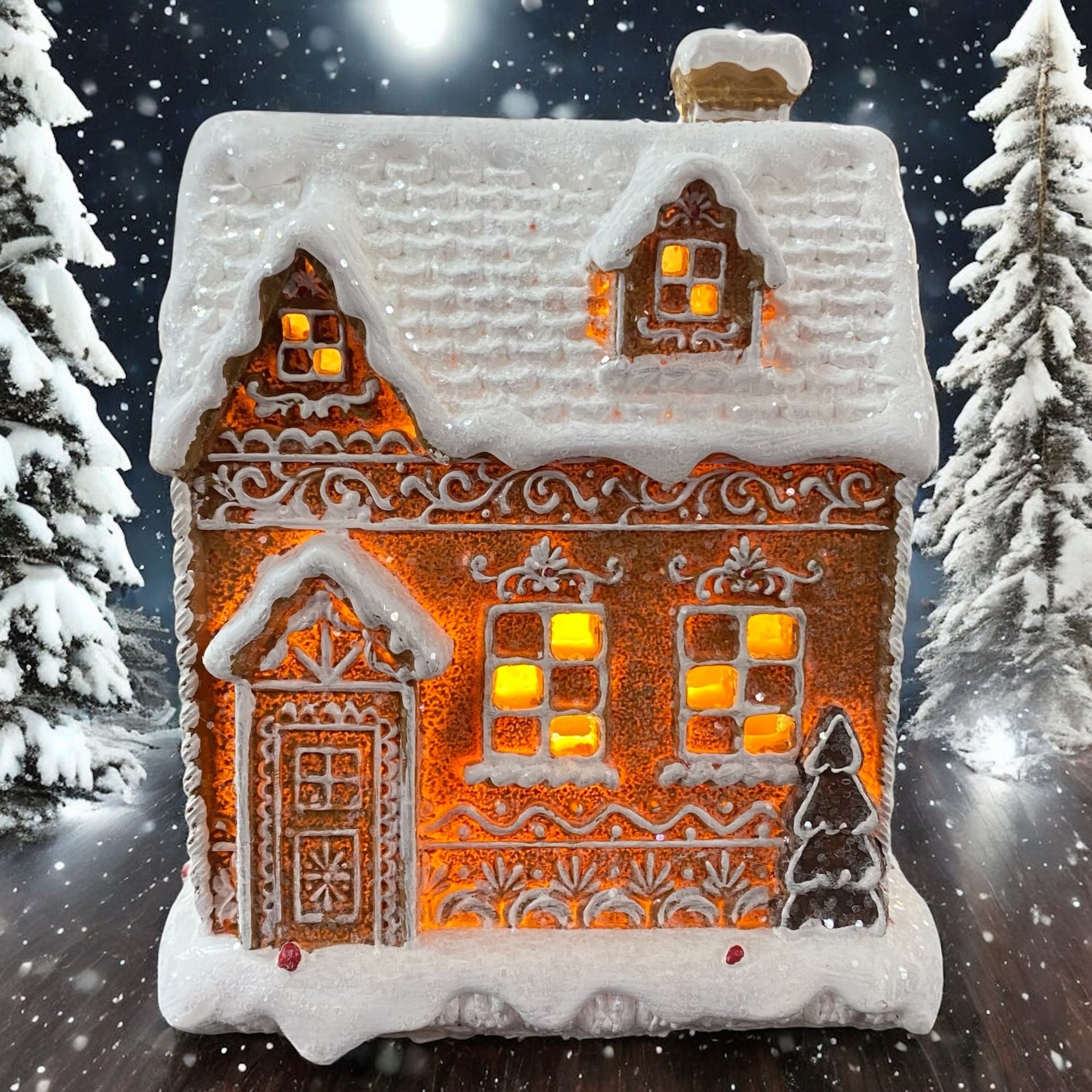 Breites Formano Lebkuchenhaus mit LED-Beleuchtung, leuchtend im verschneiten Wald arrangiert.