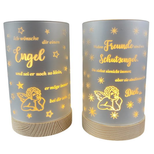 Zwei graue LED-Dekolicht-Säulen mit silbernem Schriftzug und Engelmotiv auf Holzfuß in verschiedenen Varianten.