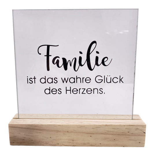 Deko Aufsteller mit Holzsockel und quadratischer Scheibe mit Aufdruck "Familie ist das wahre Glück des Lebens" vor weißem Hintergrund