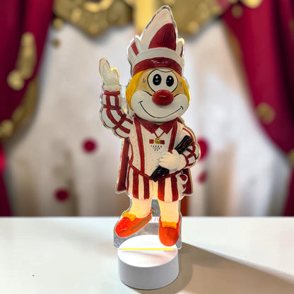 Schmitzens Karneval Deko Lampe Bauer in Schwarz und Weiß mit grünem Kopfschmuck vor rot-weißem Karnevalshintergrund.