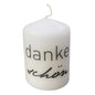 Weiße Stumpenkerze mit schwarzem Schriftzug „dankeschön“