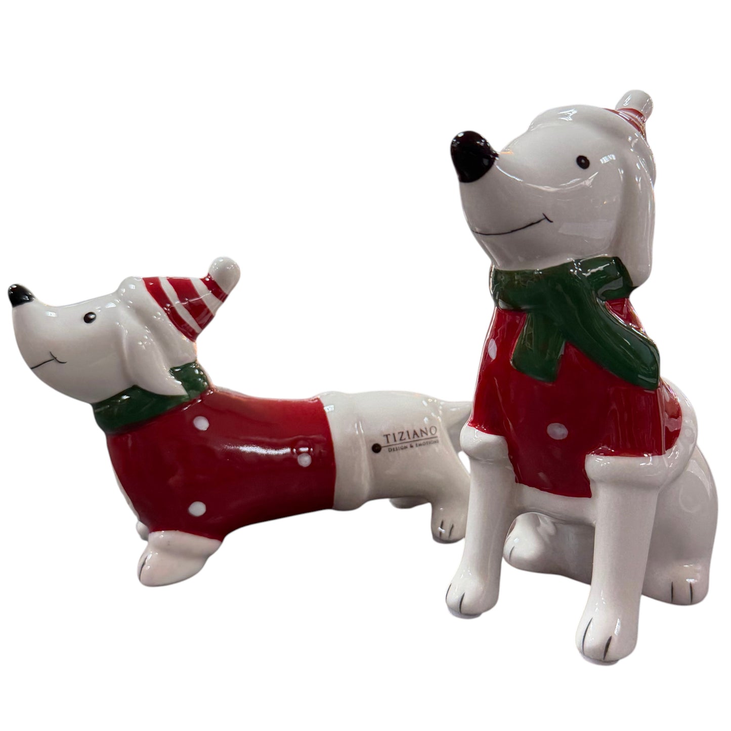 Zwei weiß-rote Tiziano Keramikhunde mit grünen Schals und Weihnachtsmützen vor weißem Hintergrund.