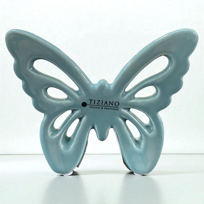 Kleiner glänzend türkiser Keramik Schmetterling von Tiziano mit filigranen Flügel-Aussparungen im Ambiente