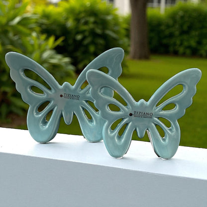 Glänzende türkise Keramik Schmetterlinge von Tiziano mit filigranen Flügel-Aussparungen im Ambiente