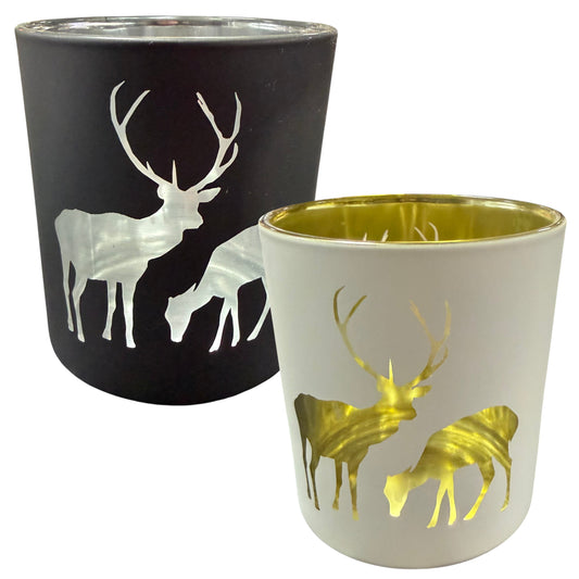 Teelichtgläser aus Glas in Schwarz und Creme mit Hirschmotiv und goldener bzw. silberner Innenbeschichtung auf weißem Hintergrund.