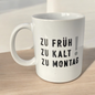 Kaffeetasse "Zu früh, zu kalt, zu Montag!" im Ambiente platziert